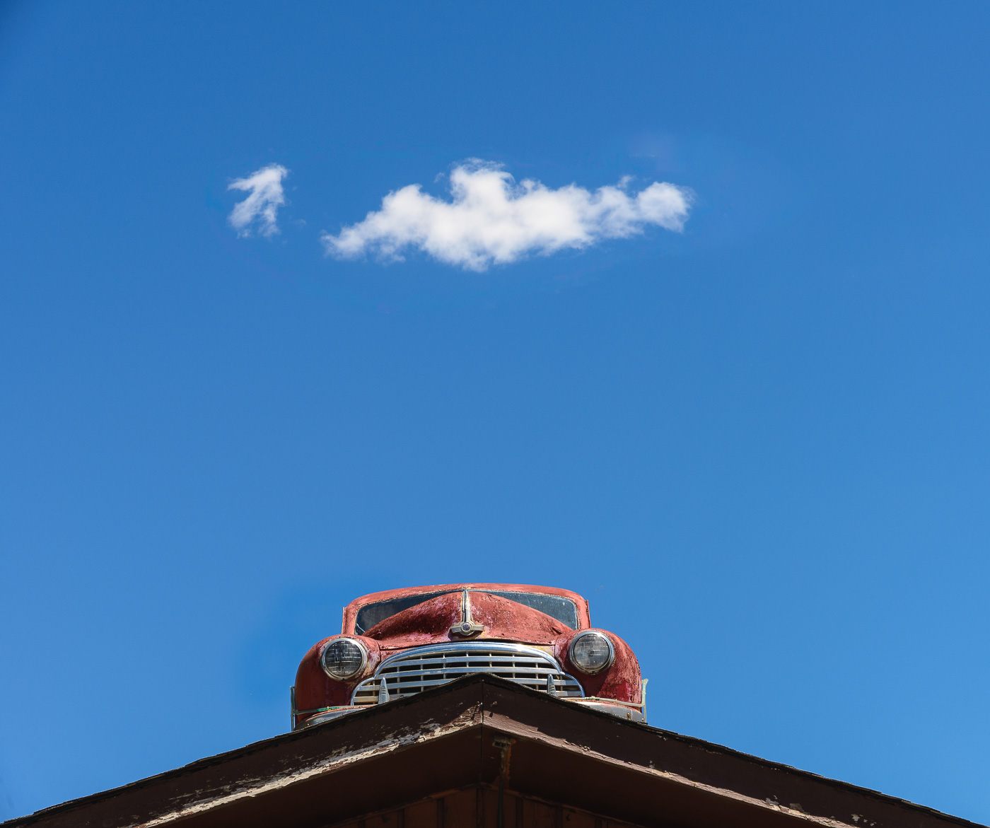 Rusty old Morris perched on a roof