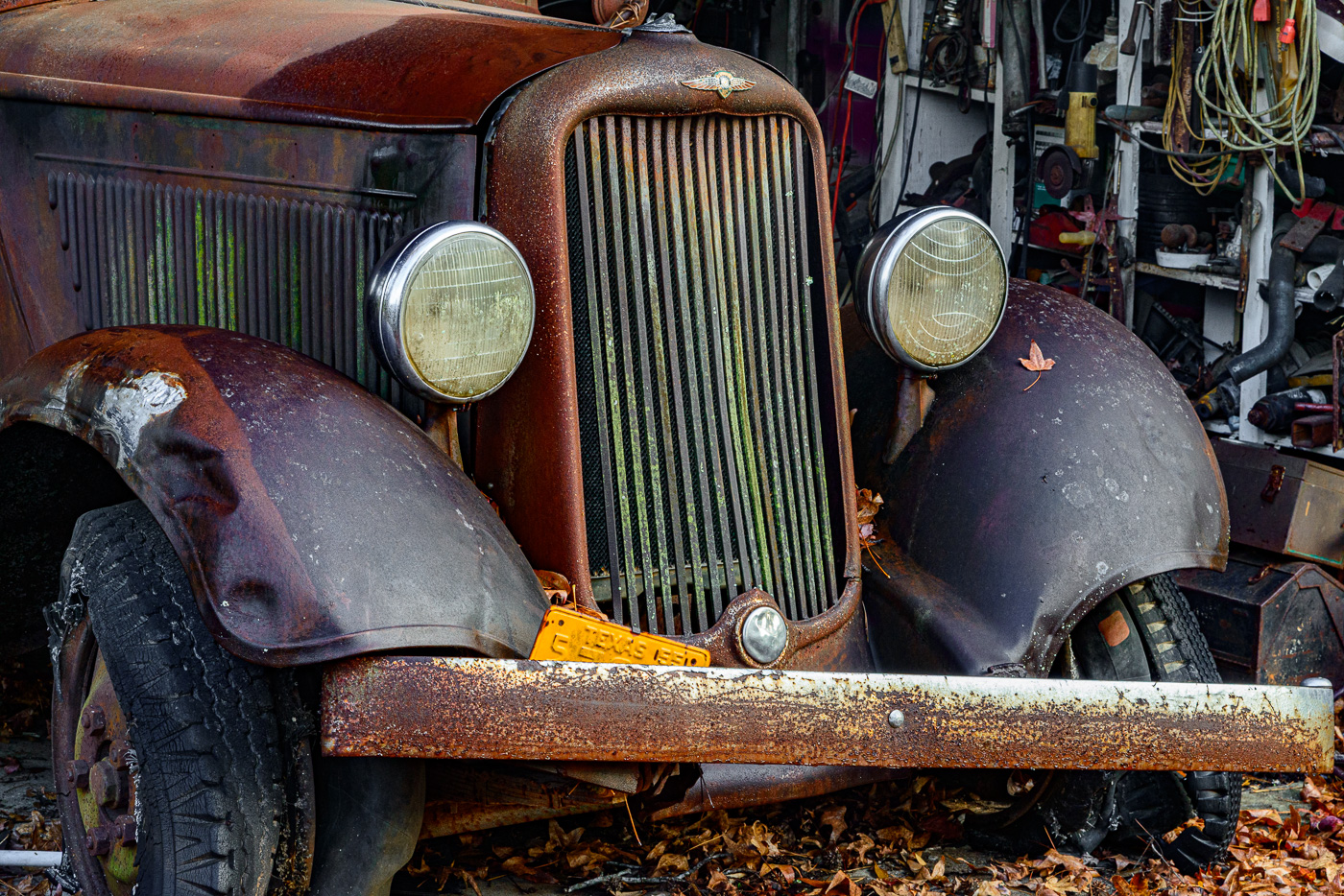 Rusty old Ford in garage